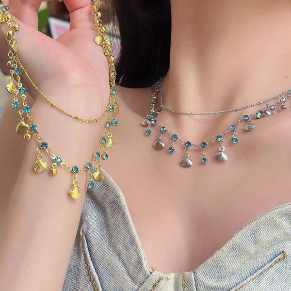 Collier ras du cou superposé avec pendentif coquillage et strass