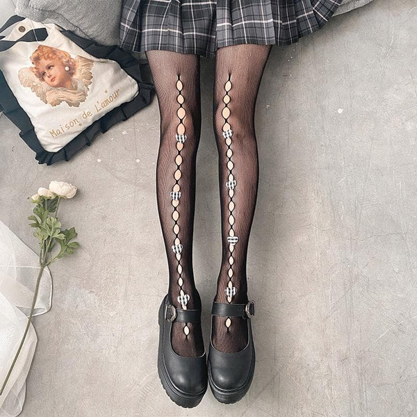 Collants en résille ajourés avec appliques en forme de cœur 