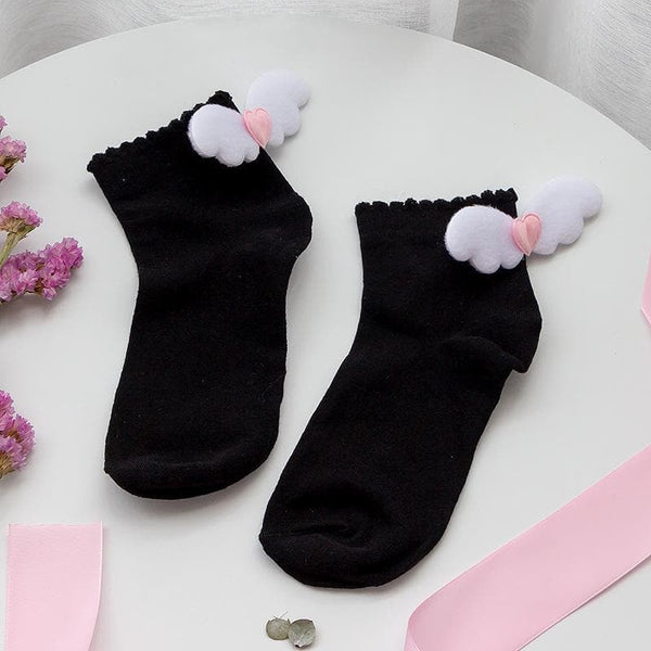 Chaussettes courtes à volants et appliques d'ailes unies 